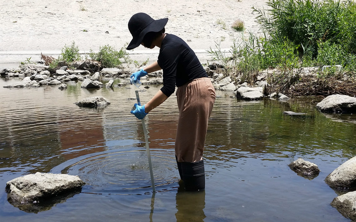 A Council for Watershed Health volunteer tests water 