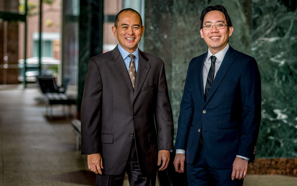 Stephen Shintani, owner of The Shintani Group, with mortgage broker Adam Kam.