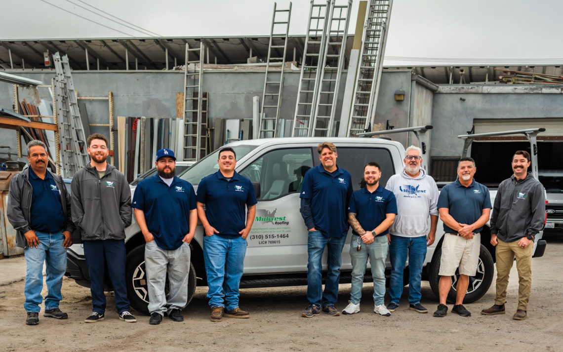 Darren Tangen, owner of Midwest Roofing Co., Inc and his employee on a job site. 